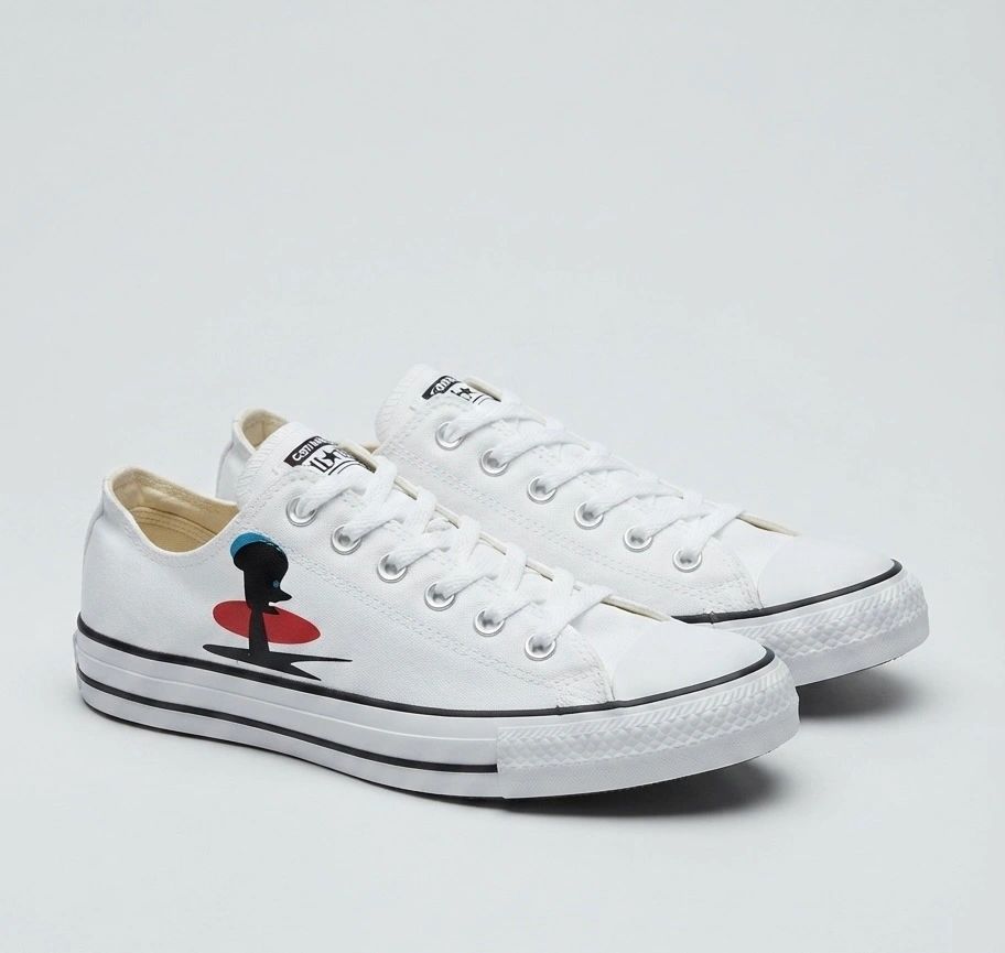 White canvas sneakers with graphic detail